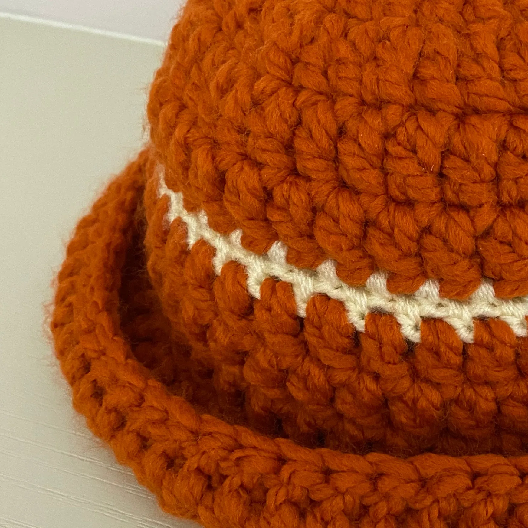 Handmade burnt orange chunky crochet bowler hat with cream stripe